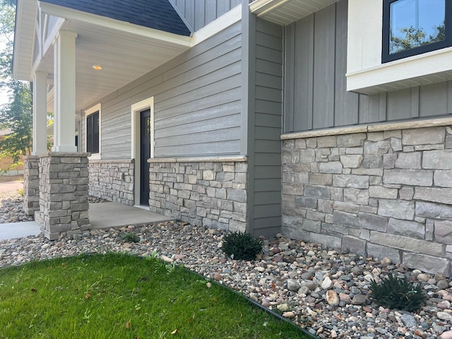 view of side of property with a porch