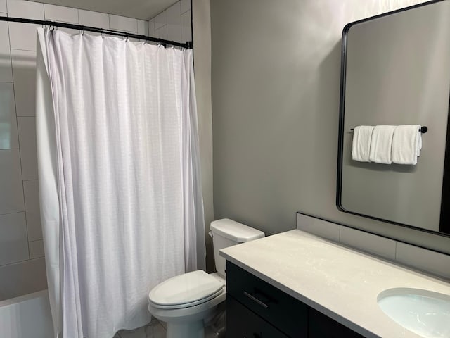 full bathroom featuring toilet, vanity, and shower / bath combo with shower curtain