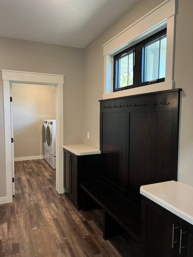 interior space featuring washer and dryer and dark wood-type flooring