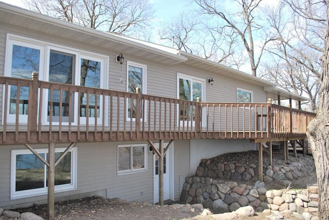 rear view of property featuring a deck