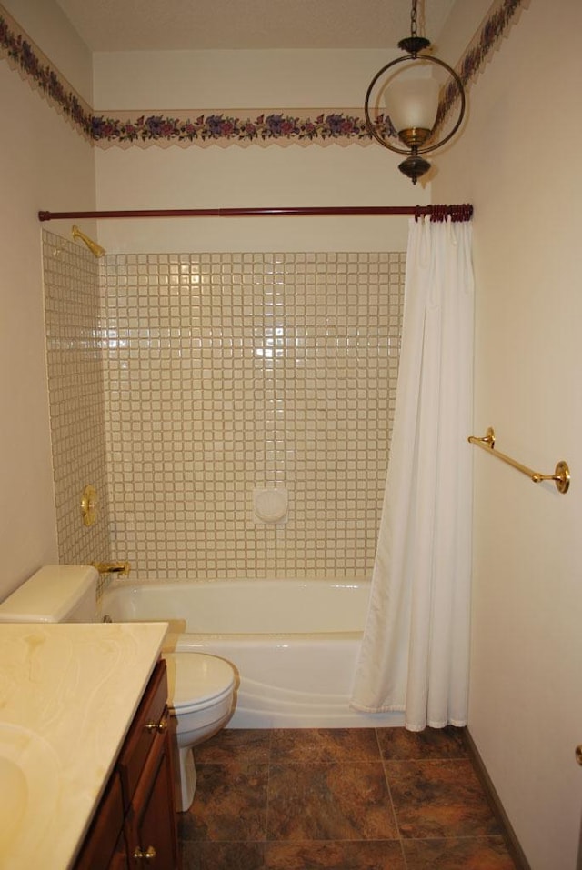 full bathroom featuring vanity, tile floors, shower / tub combo with curtain, and toilet