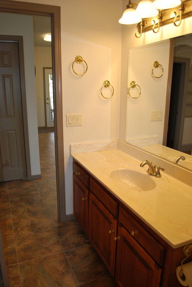 bathroom featuring tile floors and vanity with extensive cabinet space