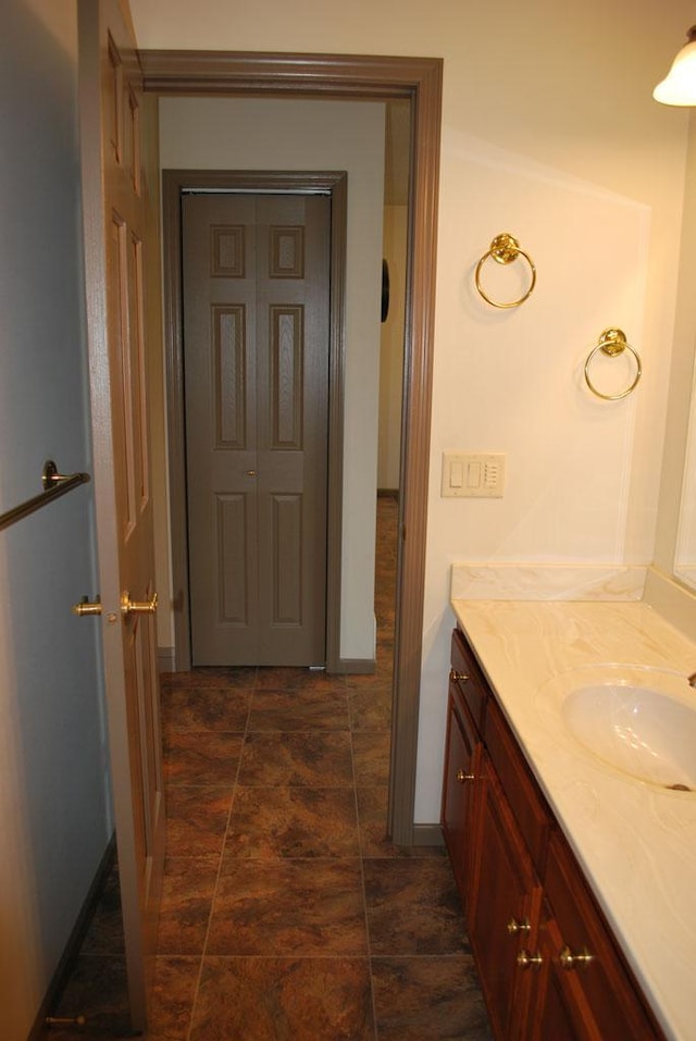 bathroom featuring tile flooring and vanity