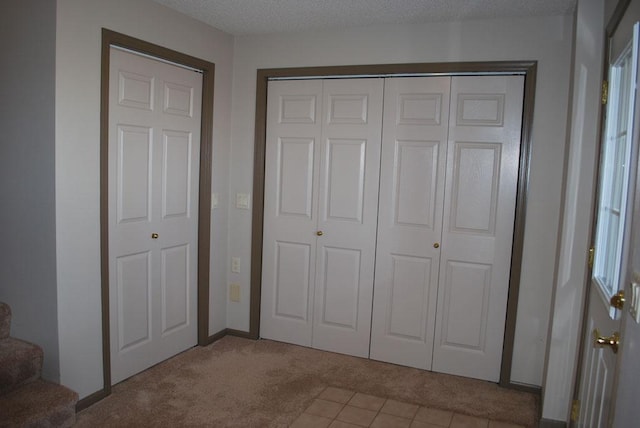 unfurnished bedroom with light tile floors