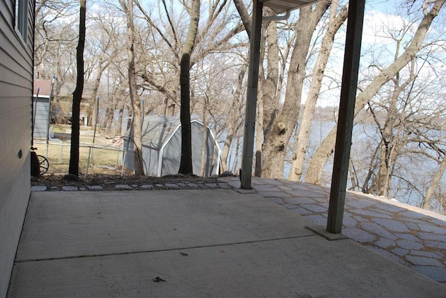 view of patio / terrace with a shed