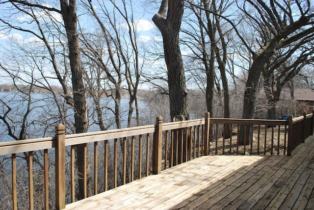 wooden deck featuring a water view