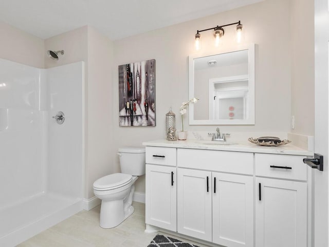 bathroom with vanity, walk in shower, tile flooring, and toilet