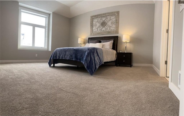 carpeted bedroom with baseboards