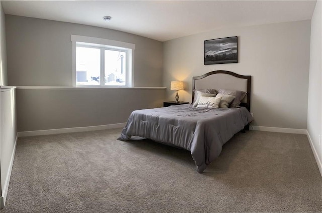 carpeted bedroom featuring baseboards