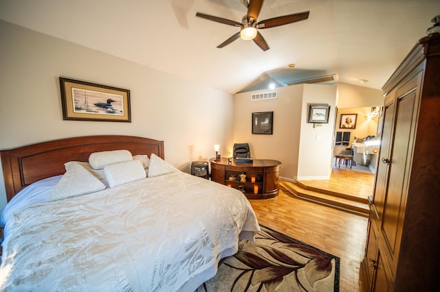 bedroom featuring ceiling fan, vaulted ceiling, and light wood-type flooring