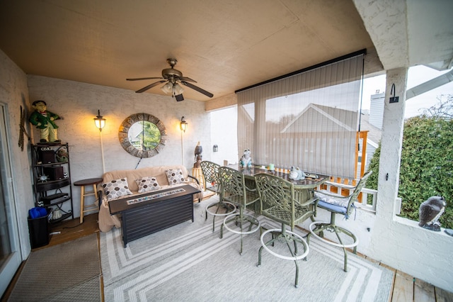 exterior space with ceiling fan and an outdoor hangout area