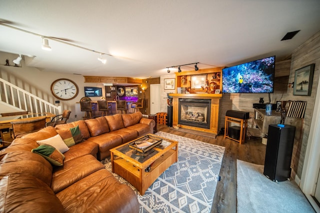 living room featuring hardwood / wood-style flooring and track lighting