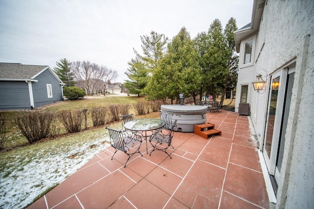 view of patio / terrace featuring a hot tub