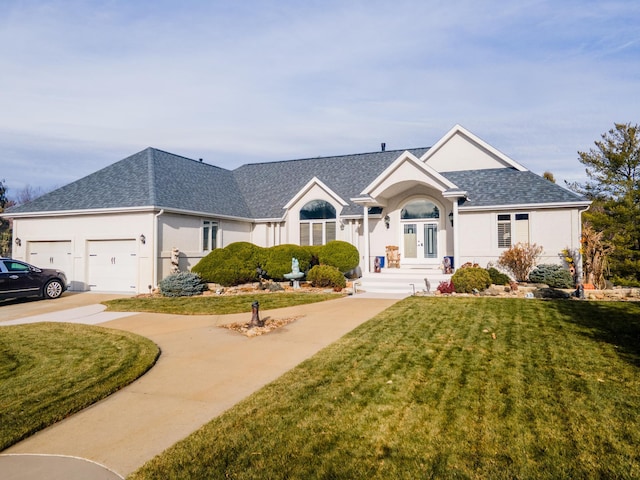 single story home with a garage and a front lawn