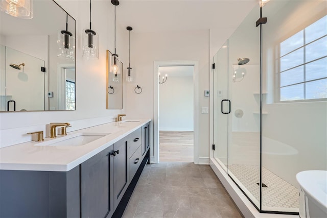 bathroom featuring vanity, tile patterned floors, and walk in shower