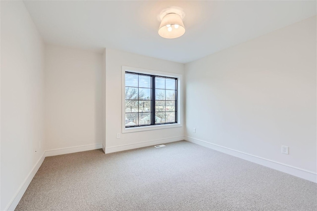 unfurnished room with carpet floors