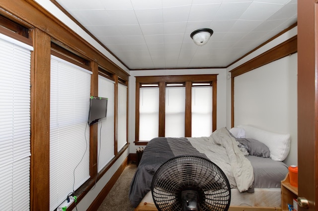 bedroom featuring carpet floors and ornamental molding