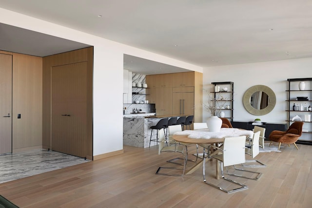 dining room featuring light hardwood / wood-style flooring