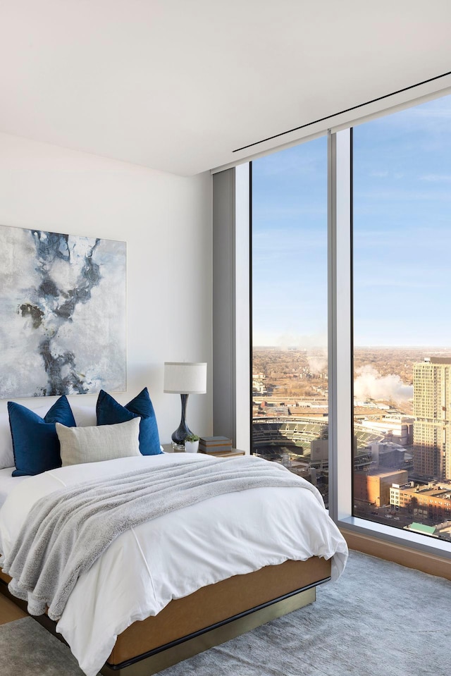 bedroom with multiple windows and floor to ceiling windows