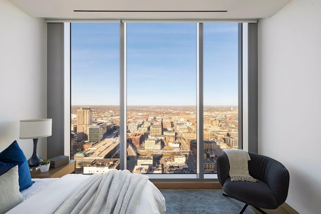 bedroom featuring a wall of windows and multiple windows