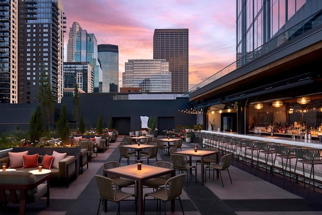 patio terrace at dusk with an outdoor hangout area