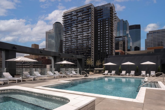 view of swimming pool featuring a patio area