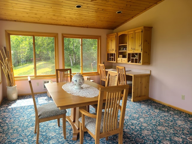 dining room featuring light carpet, wood ceiling, and vaulted ceiling