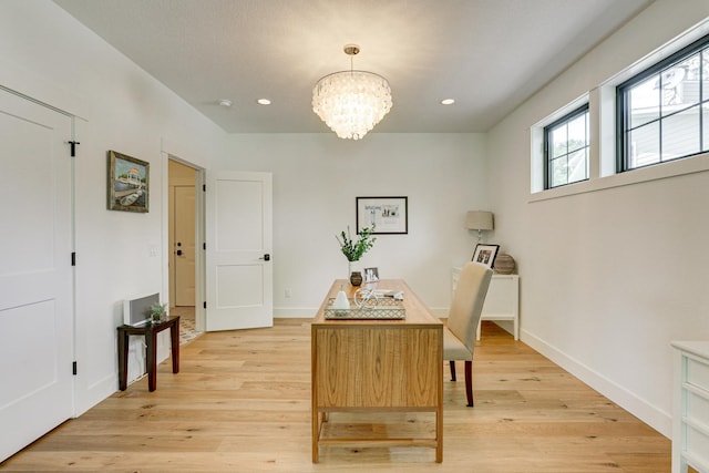 interior space featuring light hardwood / wood-style flooring and a chandelier