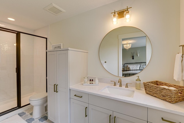 bathroom with toilet, vanity with extensive cabinet space, tile flooring, and a shower with shower door