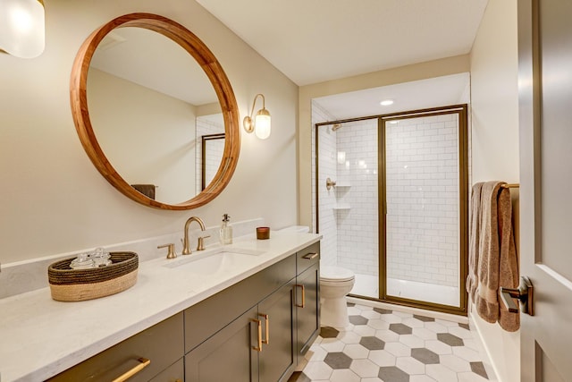 bathroom with tile floors, oversized vanity, toilet, and walk in shower