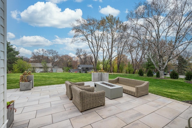 view of terrace featuring an outdoor living space with a fire pit