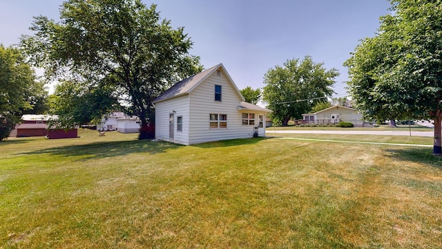 view of home's exterior with a yard