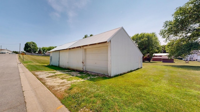 garage featuring a yard