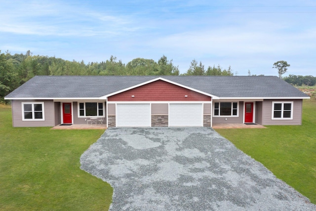 ranch-style home with a garage, a front yard, and a porch