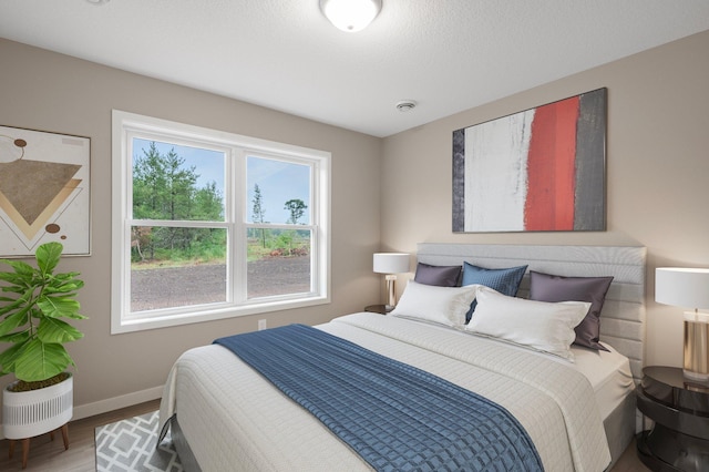 bedroom with wood-type flooring