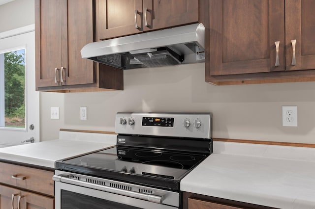 kitchen featuring stainless steel range with electric stovetop