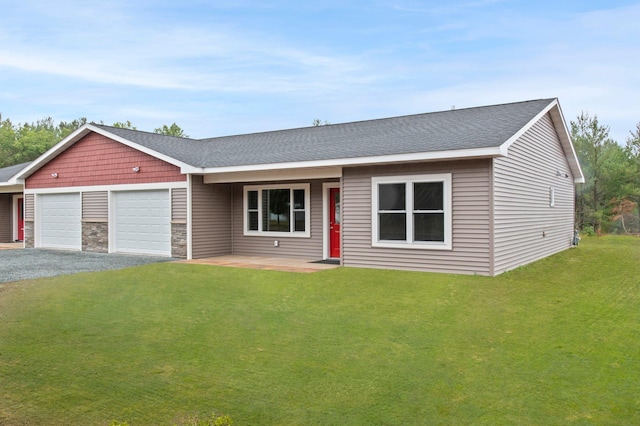 ranch-style home with a garage and a front yard