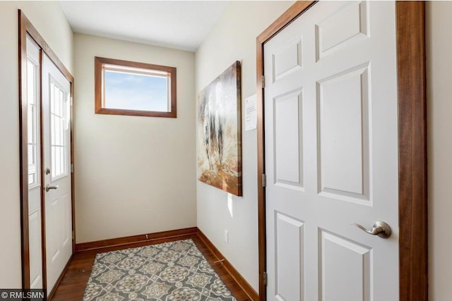 doorway with dark hardwood / wood-style floors