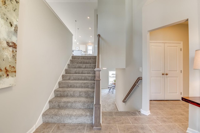 stairs with light tile floors