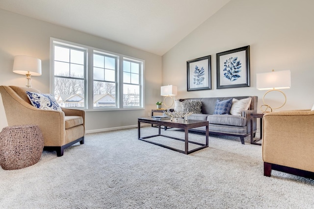 living room with lofted ceiling and light colored carpet