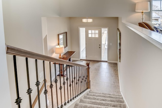 tiled foyer with a healthy amount of sunlight