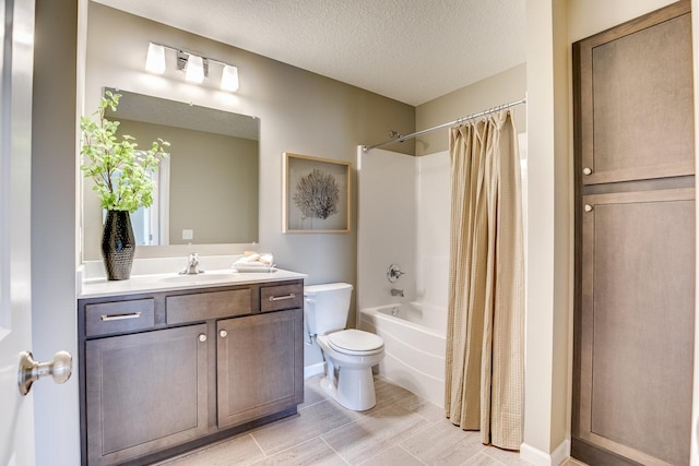 full bathroom with toilet, shower / tub combo, tile flooring, oversized vanity, and a textured ceiling