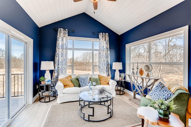 living room with light wood-type flooring, a wealth of natural light, wooden ceiling, and lofted ceiling