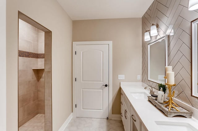 bathroom featuring a shower, tile patterned floors, and vanity