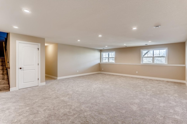 empty room featuring light colored carpet