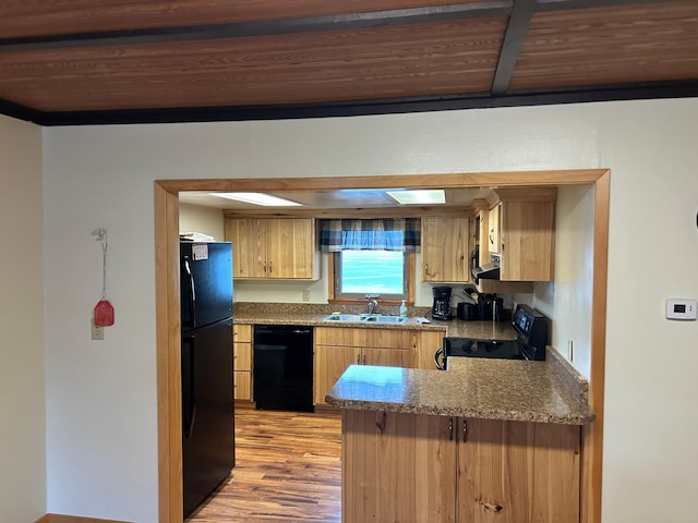 kitchen featuring wood ceiling, kitchen peninsula, black appliances, light hardwood / wood-style flooring, and sink