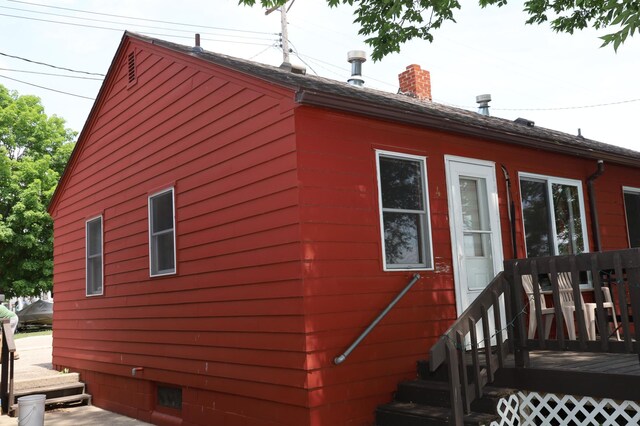 view of property exterior featuring a deck