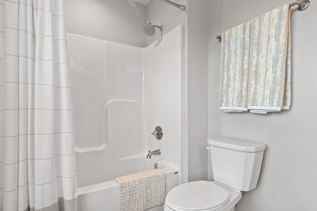 bathroom with toilet and shower / tub combo with curtain