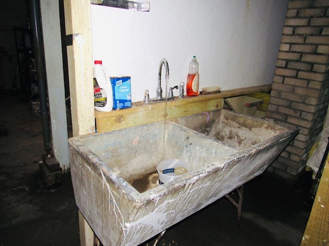 bathroom with brick wall