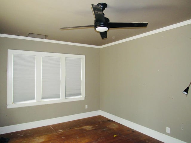 empty room featuring hardwood / wood-style floors, ornamental molding, and ceiling fan